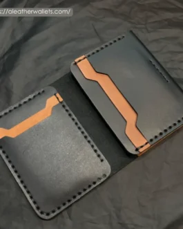 Open interior layout of a vertical leather bifold wallet showing dual-tone angular card slots and hand-stitched interior pockets.